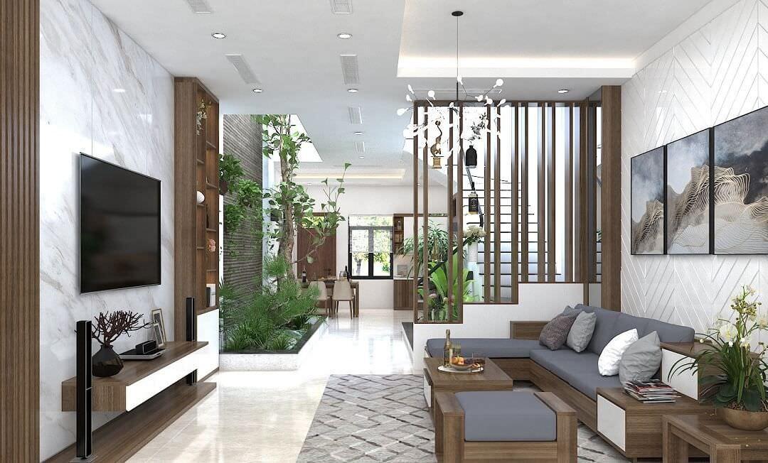 Chọn trang trí vách ngăn phòng khách với nhà bếp là giải pháp giúp tối ưu không gian, tiết kiệm thời gian và chi phí thi công